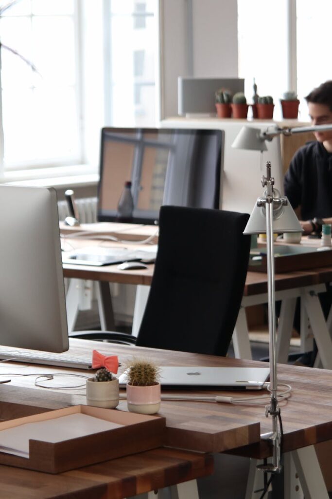 Open-plan office with modern decor and natural lighting, ideal for productivity.